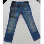 Jean bleu marine d�lav� et griff�. diesel. w28 l 34 / 38