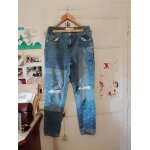 Jean a trous bleu clair 38 m amisu.