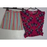 Lot d'une blouse g kids imprim�e et � liser�s argent�s et une jupe ray�e tape � l'oeil