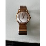 Montre lip mcanique , annes1950, plaque or , numrote qui tourne comme une horloge