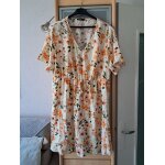 Robe neuve taille 46 - 48 fond pale motif floral