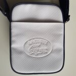 Sacoche zipp�e blanche lacoste