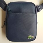 Sacoche zipp�e bleu marine lacoste