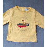 T shirt jaune girafe et guepard dans un avion. manches longues. tape a l oeil. 9 mois. 71 cm