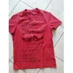 Tee shirt guess taille l ( ou m port un peu plus large).