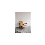 Le fauteuil en tissu bouclette safran